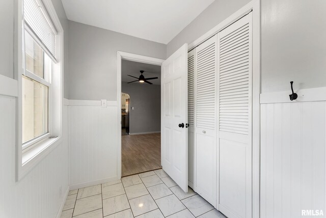 115 4th St, Colona, IL 61241 - hall with arched walkways, wainscoting, and light marble finish flooring