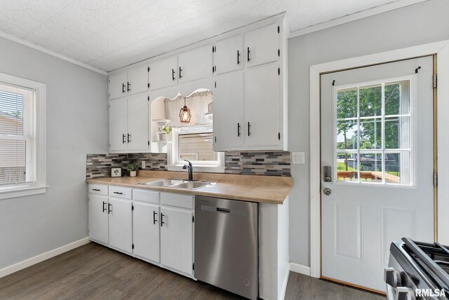 115 4th St, Colona, IL 61241 - kitchen with appliances with stainless steel finishes, backsplash, crown molding, dark wood finished floors, and white cabinetry