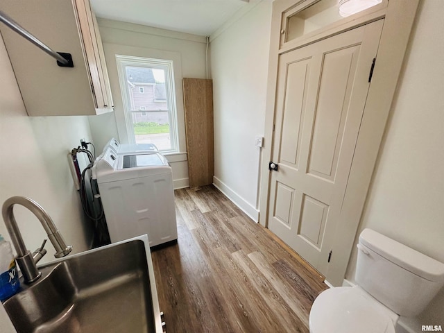 406S 3rd St, Bellevue, IA 52031 - washroom featuring wood finished floors and separate washer and dryer