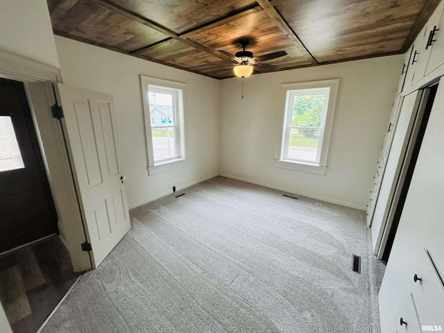 406S 3rd St, Bellevue, IA 52031 - unfurnished bedroom featuring wooden ceiling and light colored carpet