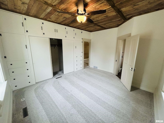 406S 3rd St, Bellevue, IA 52031 - unfurnished bedroom featuring wood ceiling, light colored carpet, a closet, and ceiling fan