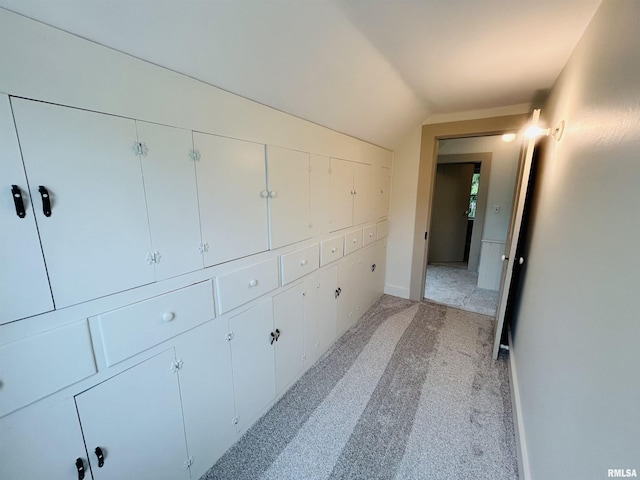 406S 3rd St, Bellevue, IA 52031 - corridor with light carpet and lofted ceiling