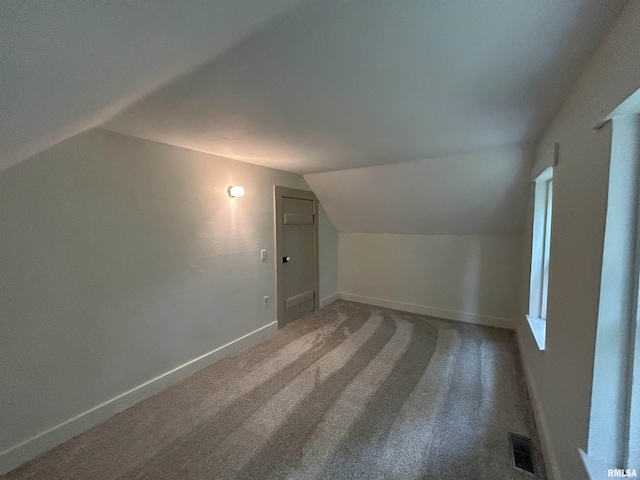406S 3rd St, Bellevue, IA 52031 - bonus room with vaulted ceiling and carpet floors