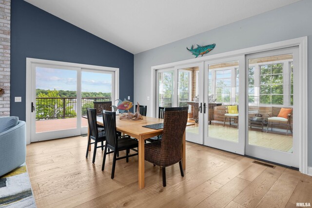 223 N 2nd St, Le Claire, IA 52753 - dining space with french doors, vaulted ceiling, and light wood-type flooring