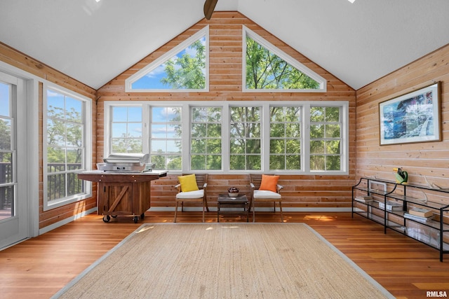 223 N 2nd St, Le Claire, IA 52753 - sunroom with wood finished floors, wood walls, and high vaulted ceiling