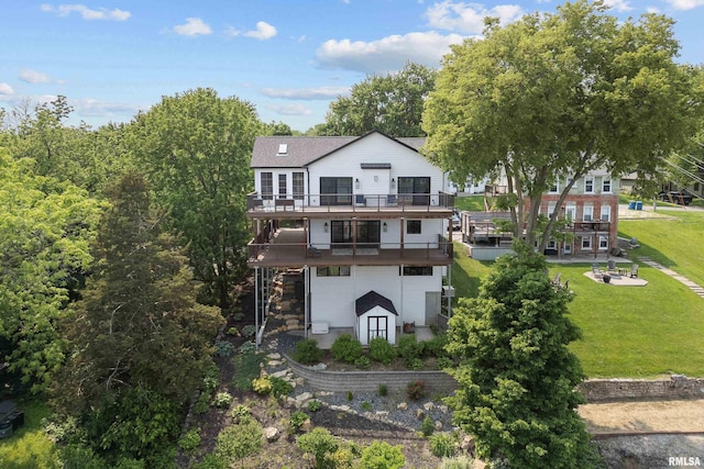 223 N 2nd St, Le Claire, IA 52753 - rear view of property featuring a wooden deck and a yard
