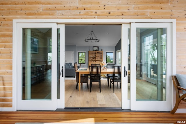 223 N 2nd St, Le Claire, IA 52753 - dining room with wood finished floors and a chandelier