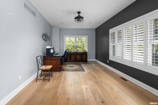 223 N 2nd St, Le Claire, IA 52753 - office featuring light wood-style floors and baseboards