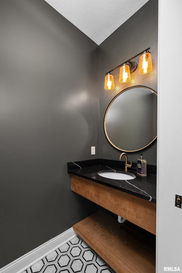 223 N 2nd St, Le Claire, IA 52753 - bathroom featuring tile patterned flooring and a textured ceiling
