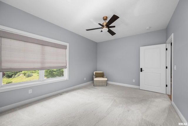 223 N 2nd St, Le Claire, IA 52753 - unfurnished room featuring carpet floors and ceiling fan