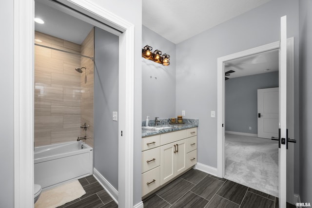 223 N 2nd St, Le Claire, IA 52753 - full bathroom with vanity, washtub / shower combination, and wood tiled floors