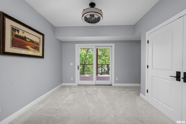 223 N 2nd St, Le Claire, IA 52753 - unfurnished room with baseboards and carpet