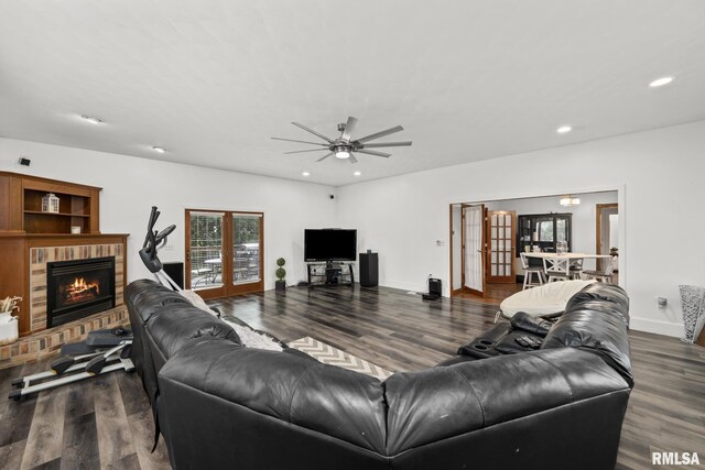 406 234th St, Aledo, IL 61231 - living area featuring dark wood-style floors, recessed lighting, a ceiling fan, french doors, and a fireplace