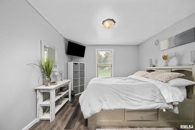 406 234th St, Aledo, IL 61231 - bedroom featuring dark wood finished floors and baseboards