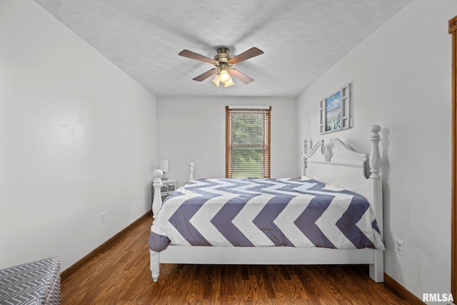 406 234th St, Aledo, IL 61231 - bedroom with a textured ceiling, a ceiling fan, and wood finished floors