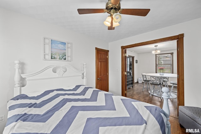 406 234th St, Aledo, IL 61231 - bedroom with wood finished floors and a ceiling fan