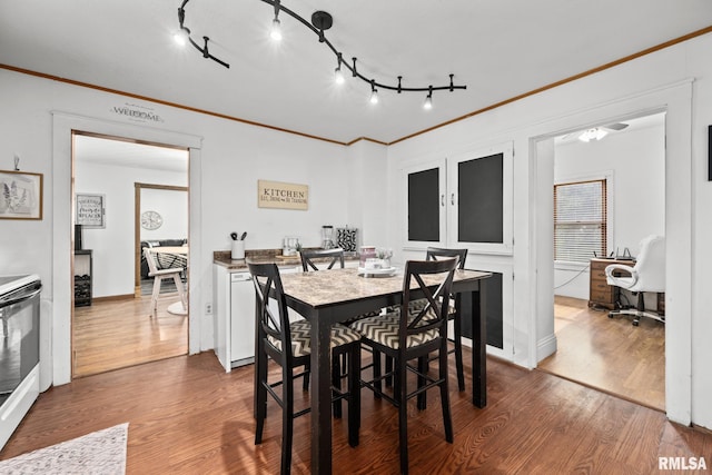 406 234th St, Aledo, IL 61231 - dining area featuring wood finished floors and crown molding