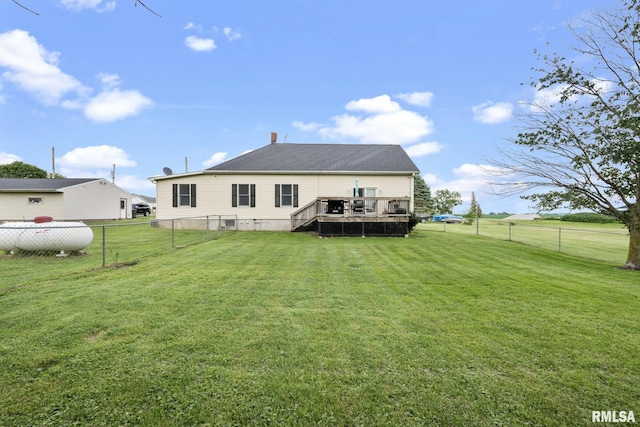 406 234th St, Aledo, IL 61231 - rear view of property with a fenced backyard and a wooden deck