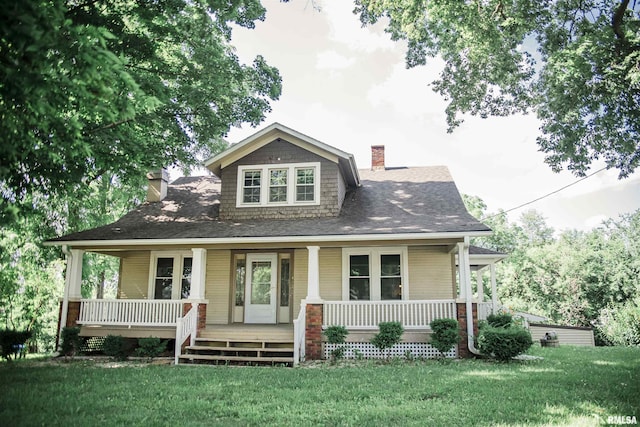 3321 State St, Quincy, IL 62301 - view of front of home featuring a chimney, a porch, and a front yard