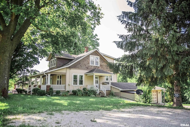 3321 State St, Quincy, IL 62301 - view of front of house with a front lawn, a chimney, and gravel driveway
