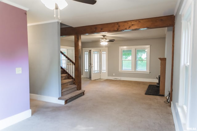3321 State St, Quincy, IL 62301 - unfurnished living room featuring ceiling fan, carpet floors, beamed ceiling, and stairs