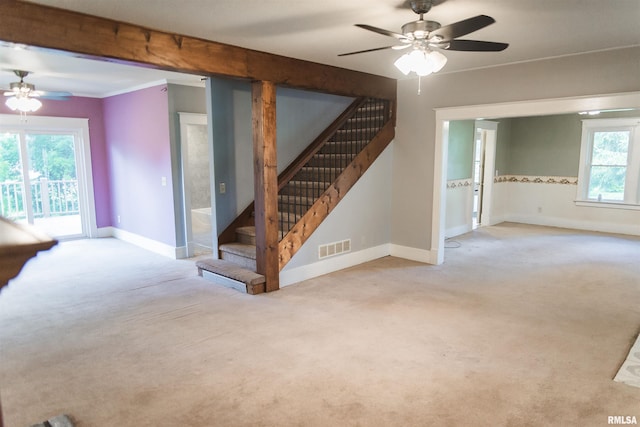 3321 State St, Quincy, IL 62301 - unfurnished living room featuring ceiling fan, stairway, and carpet flooring