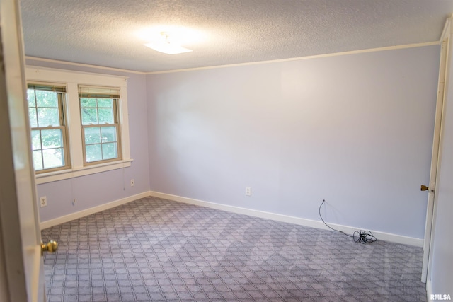3321 State St, Quincy, IL 62301 - unfurnished room featuring carpet floors, a textured ceiling, and ornamental molding