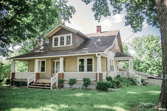 3321 State St, Quincy, IL 62301 - view of front of property featuring a chimney, a porch, and a front lawn