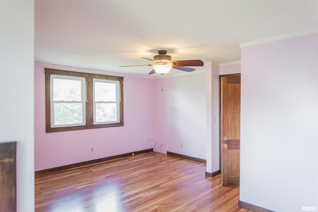 3321 State St, Quincy, IL 62301 - empty room with a ceiling fan, ornamental molding, and light wood finished floors