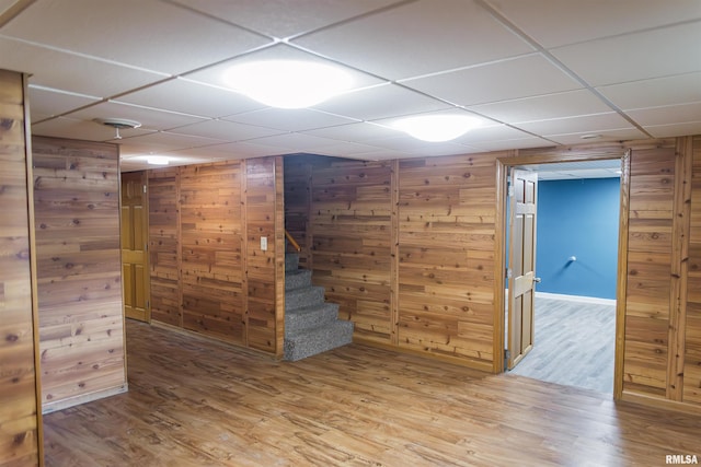 3321 State St, Quincy, IL 62301 - finished basement featuring wood finished floors, wooden walls, a drop ceiling, and stairway