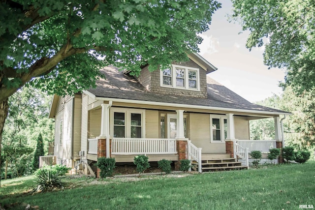3321 State St, Quincy, IL 62301 - view of front facade featuring covered porch, a front lawn, and a shingled roof