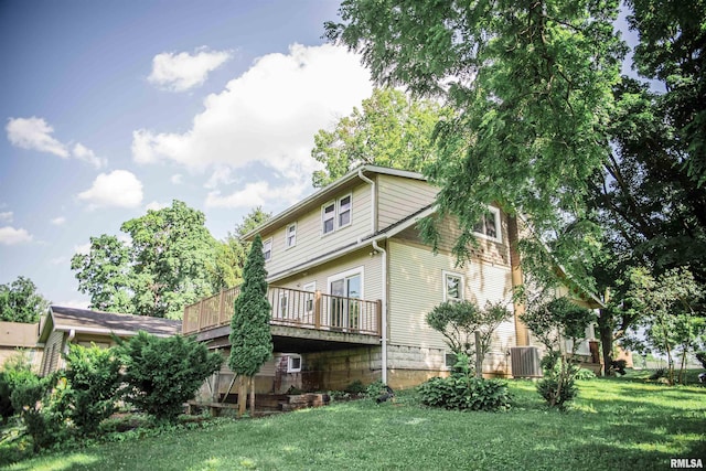 3321 State St, Quincy, IL 62301 - rear view of property featuring a yard and a wooden deck