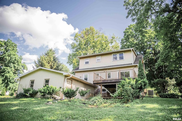 3321 State St, Quincy, IL 62301 - rear view of property with a lawn and a deck