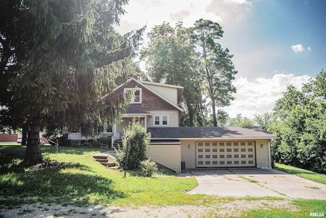 3321 State St, Quincy, IL 62301 - view of front of home featuring driveway, an attached garage, and a front lawn