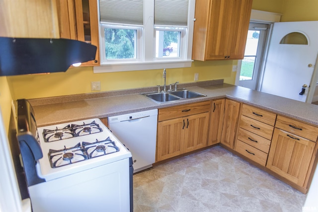 3321 State St, Quincy, IL 62301 - kitchen featuring white appliances, healthy amount of natural light, range hood, and a peninsula