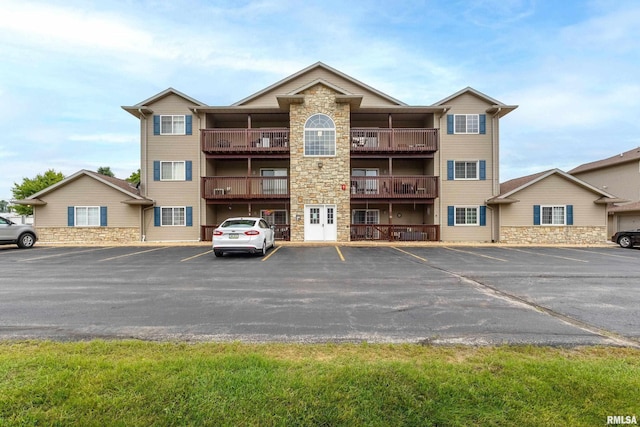 109 E Price St Unit 203, Eldridge, IA 52748 - view of property featuring uncovered parking