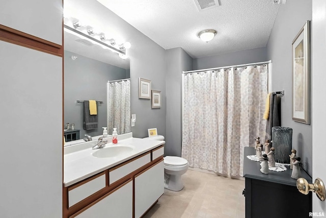 109 E Price St Unit 203, Eldridge, IA 52748 - bathroom with vanity, a textured ceiling, curtained shower, and tile patterned flooring