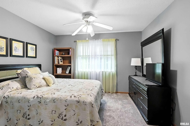 109 E Price St Unit 203, Eldridge, IA 52748 - bedroom with light colored carpet and ceiling fan