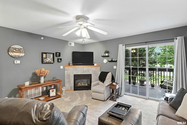 109 E Price St Unit 203, Eldridge, IA 52748 - carpeted living area with a ceiling fan and a tiled fireplace