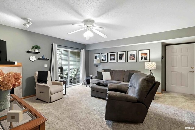 109 E Price St Unit 203, Eldridge, IA 52748 - carpeted living room featuring a ceiling fan and a textured ceiling