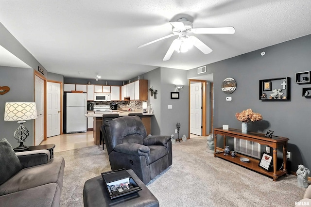 109 E Price St Unit 203, Eldridge, IA 52748 - living area with ceiling fan and baseboards