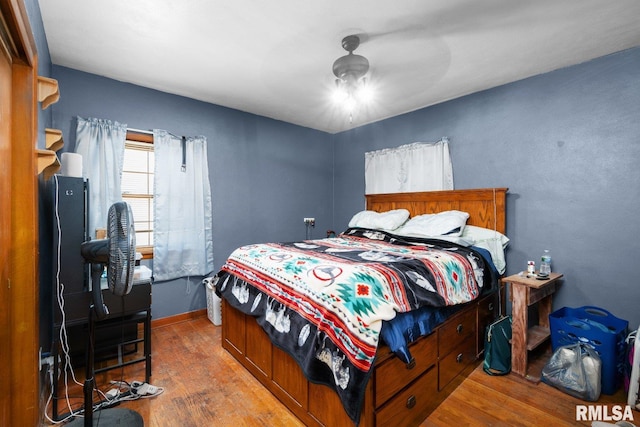2207 4th St Unit A, East Moline, IL 61244 - bedroom with wood finished floors and a ceiling fan