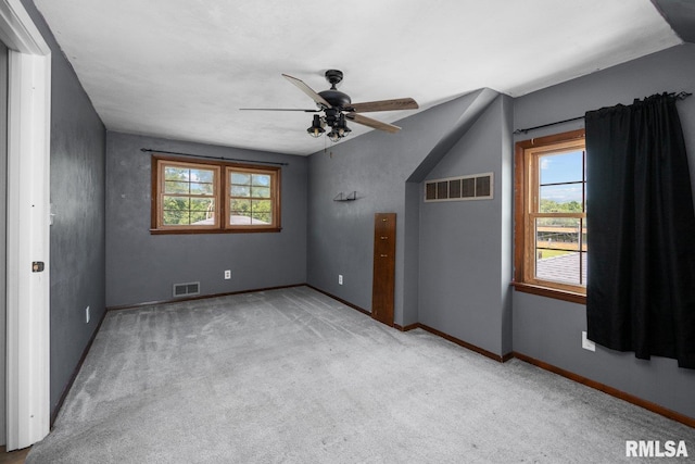 2207 4th St Unit A, East Moline, IL 61244 - carpeted empty room featuring ceiling fan and baseboards