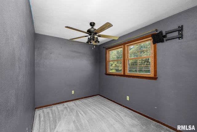 2207 4th St Unit A, East Moline, IL 61244 - carpeted spare room featuring a ceiling fan and baseboards