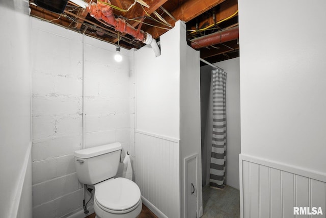 2207 4th St Unit A, East Moline, IL 61244 - bathroom with wainscoting, radiator, and a shower with curtain