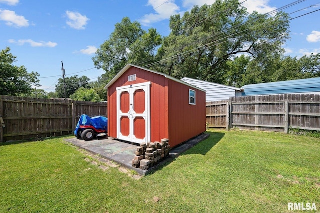 2207 4th St Unit A, East Moline, IL 61244 - view of shed with a fenced backyard