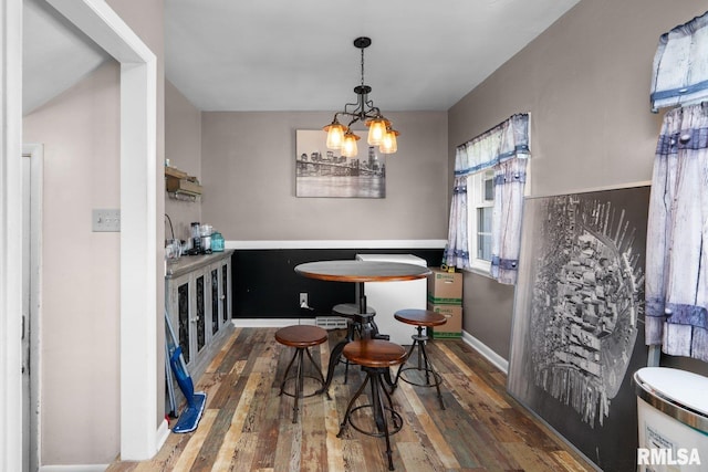 2207 4th St Unit A, East Moline, IL 61244 - dining area featuring wood finished floors and a chandelier