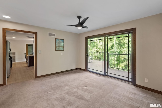 17 Wildwood Trl, Bettendorf, IA 52722 - unfurnished room featuring light carpet and a ceiling fan