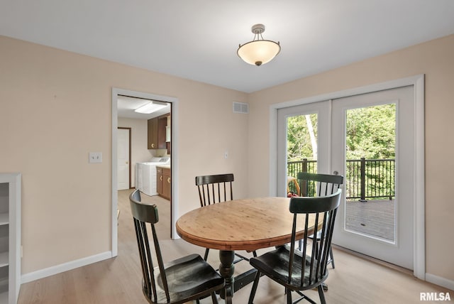 17 Wildwood Trl, Bettendorf, IA 52722 - dining area with light wood finished floors and washer and clothes dryer
