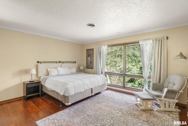 17 Wildwood Trl, Bettendorf, IA 52722 - bedroom featuring crown molding, wood finished floors, and a textured ceiling
